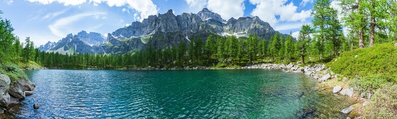 Naklejka na ściany i meble The black lake( Lago Nero ): a beautiful alpine lake located within the Alpe veglia - Devero natural park, near the town of Baceno, Italy - July 2021.