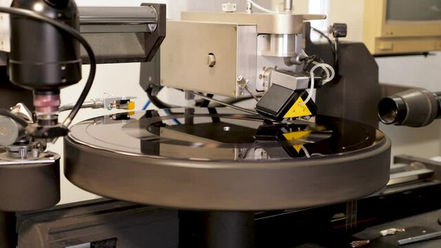 Recording tracks to the music vinyl disc form on a lathe machine, cutting music onto a lacquer