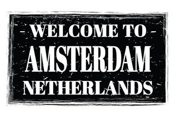 Fototapeta premium WELCOME TO AMSTERDAM - NETHERLANDS, words written on black stamp