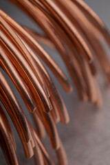 Copper wire non-ferrous metals, product metalworking industry. Abstract metal shapes.