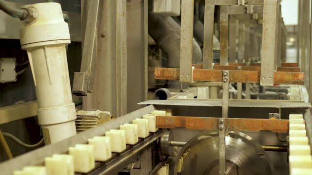 Vinyl record factory: Lacquers picked up by machine before dipping into a nickle bath