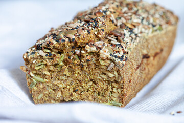 minimalistic creative beige background with green buckwheat bread nd organic buckwheat milk. Harmless, wellness, gluten free healthy baking. Alternative bread. Copy spase.