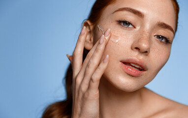 Skin care beauty, women. Sensual young redhead girl with perfect, flawless skin, glowing healthy...