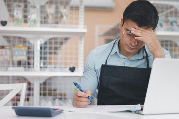 Male entrepreneur store owner feel stressful regret and sad in business crisis during covid pandemic