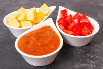 Homemade pumpkin sauce or ketchup with ingredients in bowls