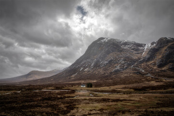 Remote cottage in Glencoe with dramatic sky © grahammoore999