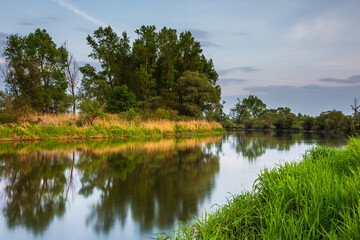 Fototapeta na wymiar Sunset over Warta river in Warta Landscape Park, Poland.