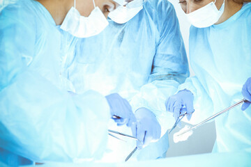 A group of surgeons is operating at the hospital. Health care concept