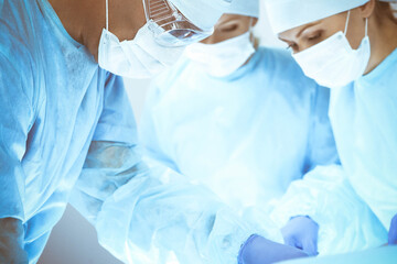 Fototapeta premium A group of surgeons is operating at the hospital. Health care concept