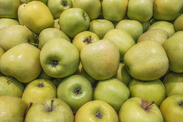 green apples on the counter on the market close up