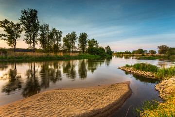 Sunset over Warta river in Warta Landscape Park, Poland.