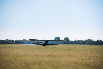 Fototapeta na wymiar Flight of an agricultural aviation aircraft