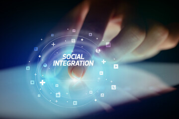 Finger touching tablet with social media icons concept
