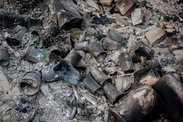 Food rubbish and tin cans burnt on a bonfire