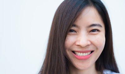 Fototapeta premium close up attractive adult business woman asian girl with happy and smile against white concrete wall office.