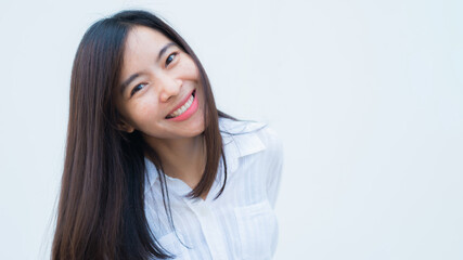 Fototapeta premium close up attractive adult business woman asian girl with happy and smile against white concrete wall office.