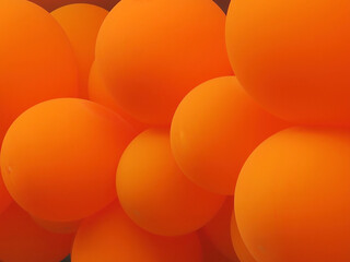 close-up of a collection of orange colored balloons