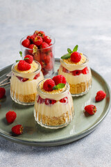 Homemade raspberry trifles on a light background.