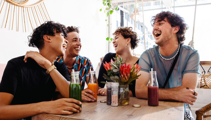 Fun friends laughing together in a restaurant
