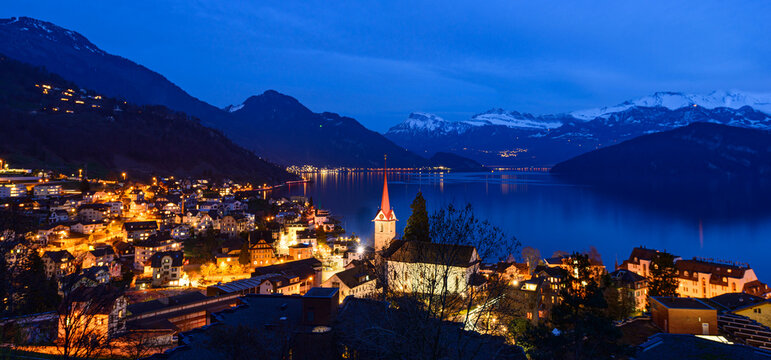 Night panorama. Lights of the city of Weggis. Switzerland. Lake Lucerne.