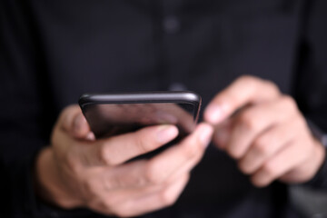 Close up of man using mobile phone.