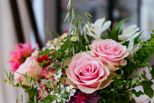 Spring flowers bouquet with pink roses