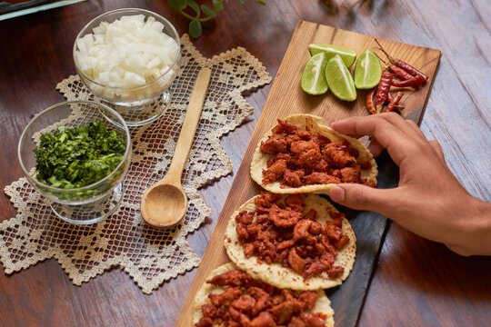 Authentic Mexican tacos on wooden table. Mexican gastronomy concept.