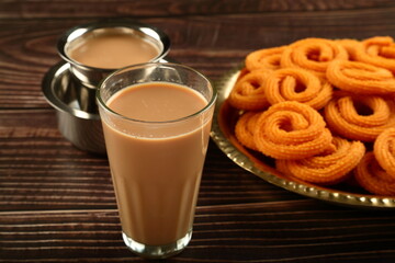 Traditional Indian milk tea, masala chai, with snacks.