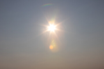 Fototapeta premium sun with beams in the sky as background