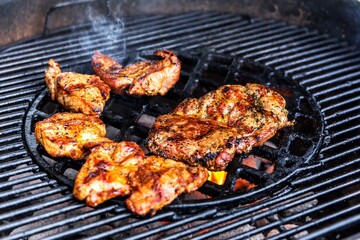 Fresh grilled meat. Preparing meat on the grill. Close-up view of a hot grill with meat.