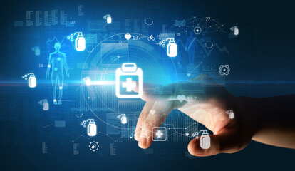 Doctor hand pressing futuristic health device with medical symbol on screen