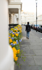 Attractive young female walking around the streets of Inverness Terrace, near Hyde Park, London