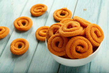 Bowl of murukku, muruku, chakli, chakkli, Indian savory snacks.