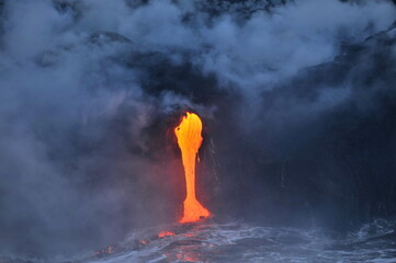 Hawaii. Volcanic eruption. Fiery lava flows into the ocean