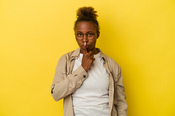 Young african american woman isolated on yellow background thinking and looking up, being reflective, contemplating, having a fantasy.