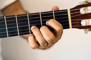 Guitar chord, D major chord. 
D, Male hand playing guitar chords