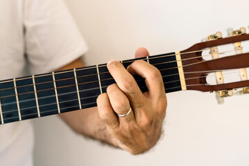 Guitar chord, G major chord. 
G, Male hand playing guitar chords