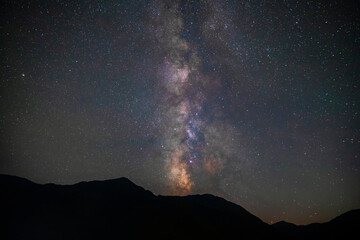 Milky way over mountains in summer