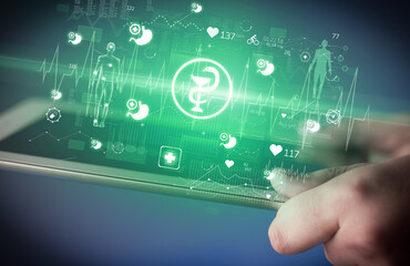 Close-up of a touchscreen with healthcare icons