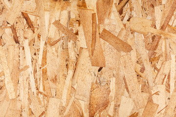 Wood texture. Osb wood board for background decoration. OSB board texture. Brown wooden background.