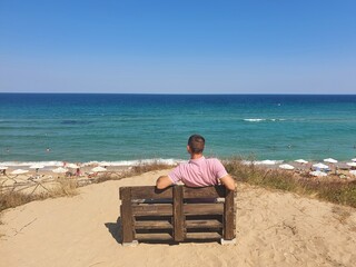 man sitting on the beach