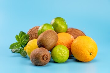 Tropical food citrus fruit assortment. healthy blue background.