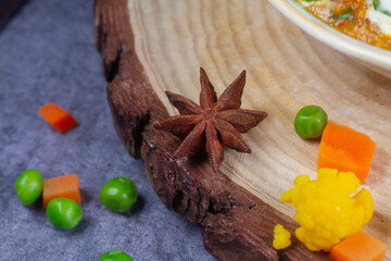 star anise on wooden background. close up and selective focus
