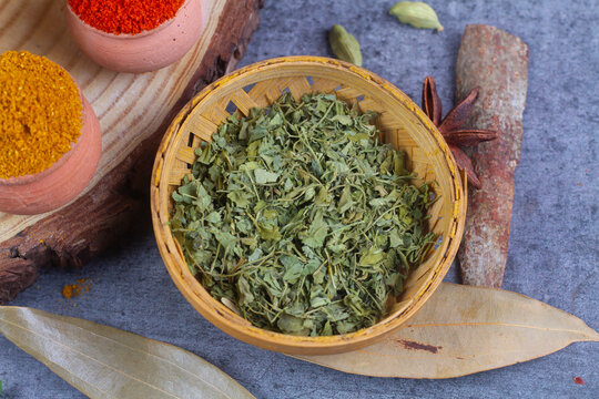 kasoori methi in bamboo bowl on wooden background