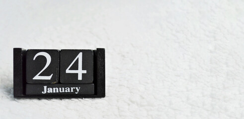 Wooden calendar from blocks on white background with copy space. 24th of January