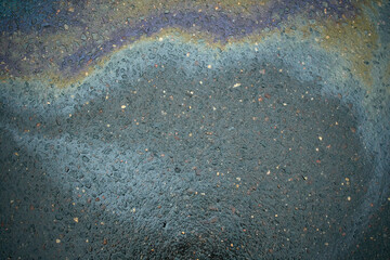 Oil stain on Asphalt, color Gasoline fuel spots on Asphalt Road as Texture or Background
