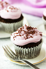 Chocolate cupcakes with a purple topping