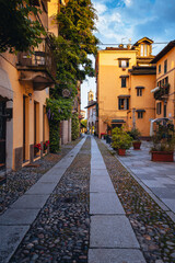 Fototapeta na wymiar Orta San Giulio / Italy - June 2021: Main street of the village of Orta San Giulio, without people