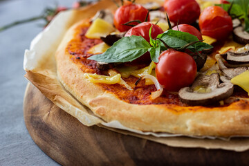 Vegan pizza with tomatoes and mushrooms