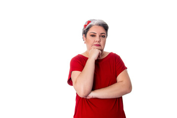 young lady wearing red outfit on white background with hand on chin thoughtful.
